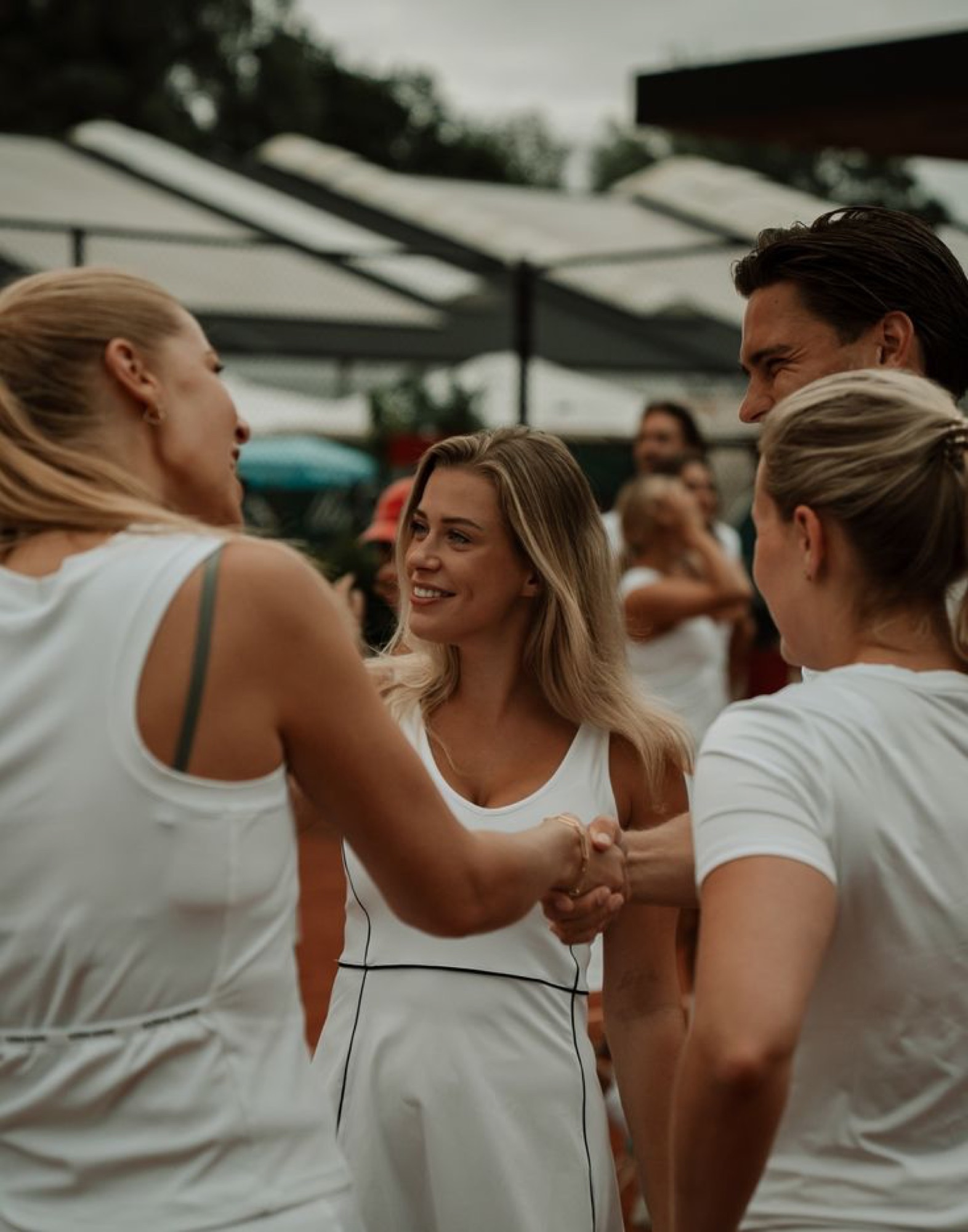 Singles meeting and shaking hands at a Just Singles Dubai padel mixer