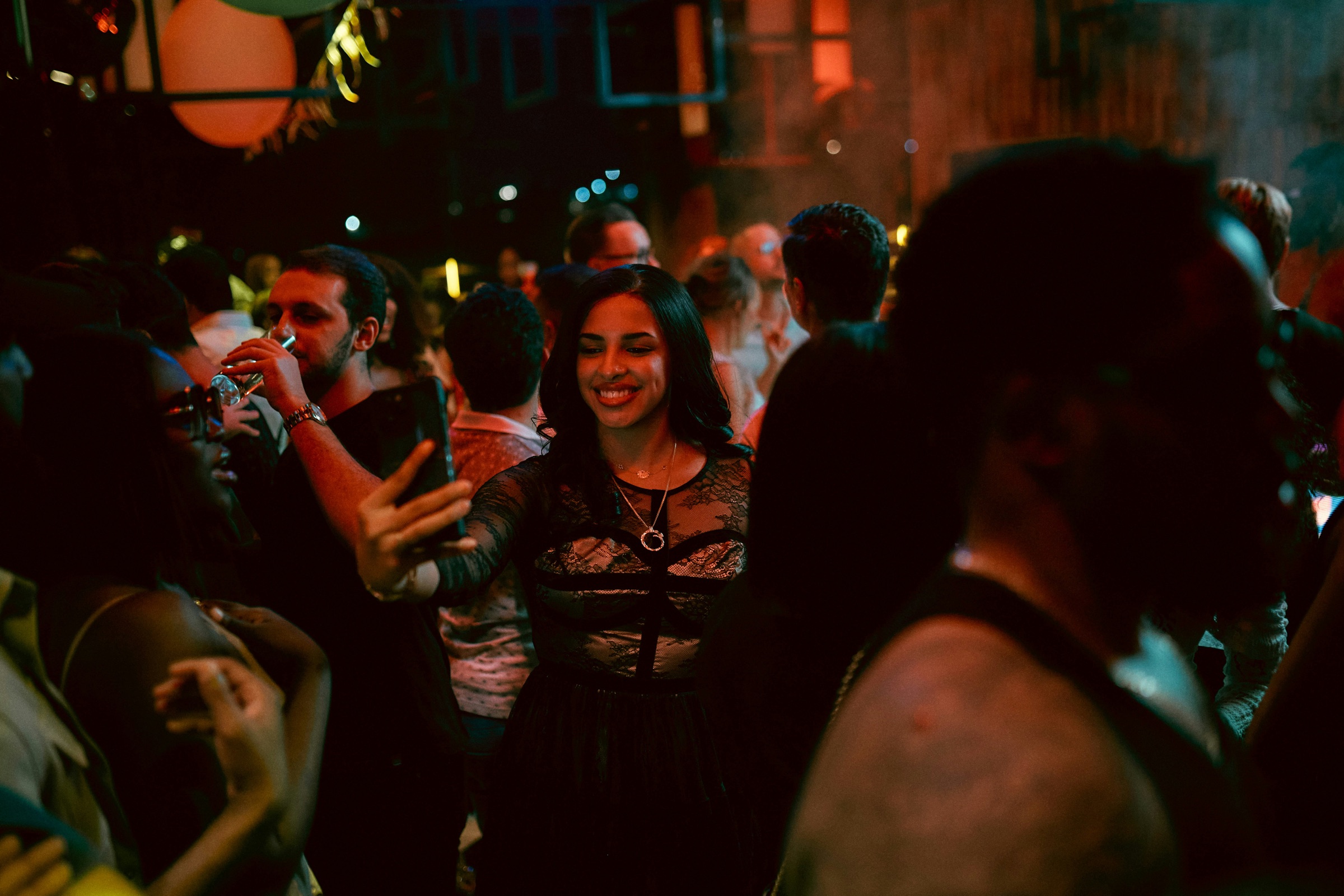 A full room of guests talking and mingling at a Just Singles Dubai night